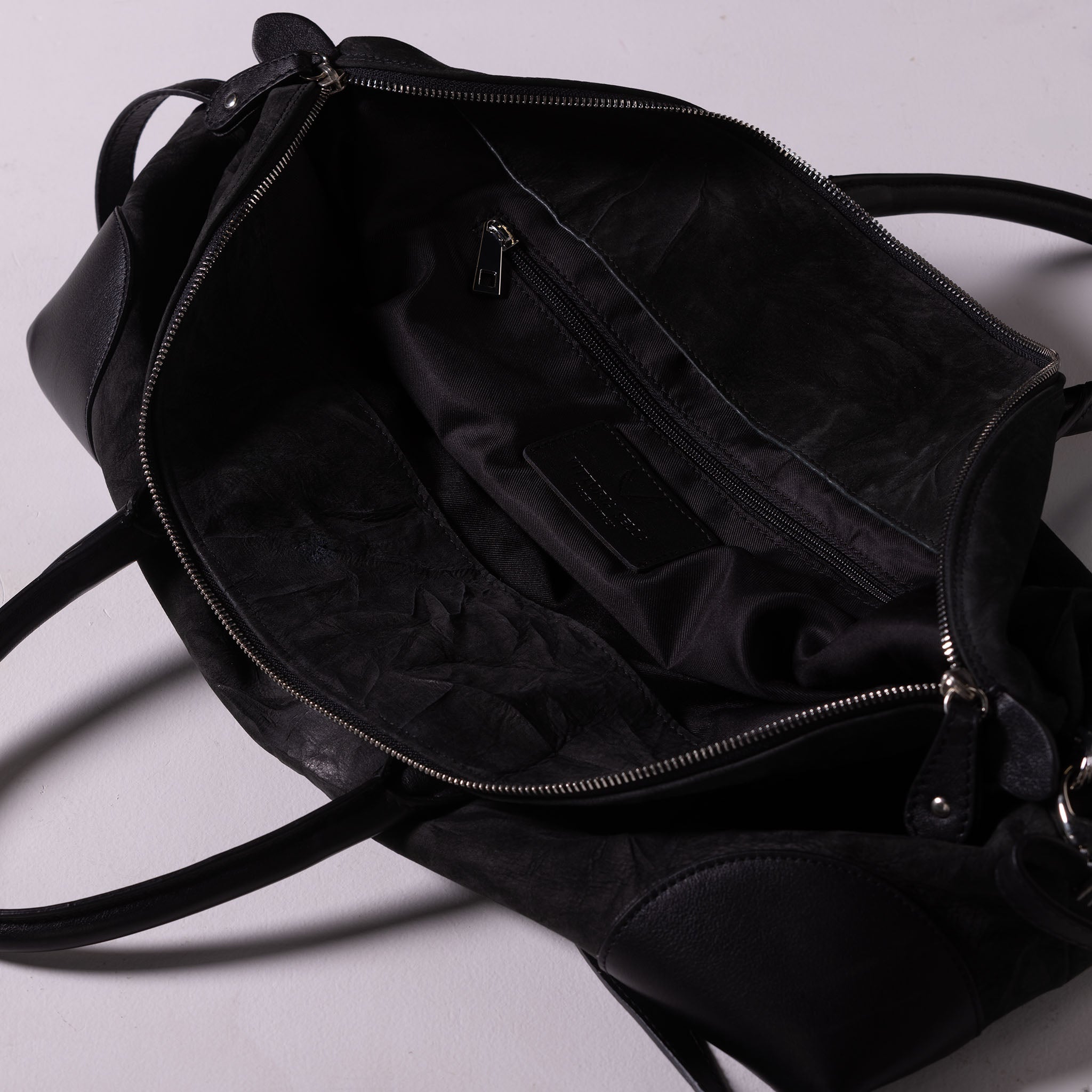 Vesta Maxi Tote Ebony inside view in black nubuck-effect leather with contrasting textures