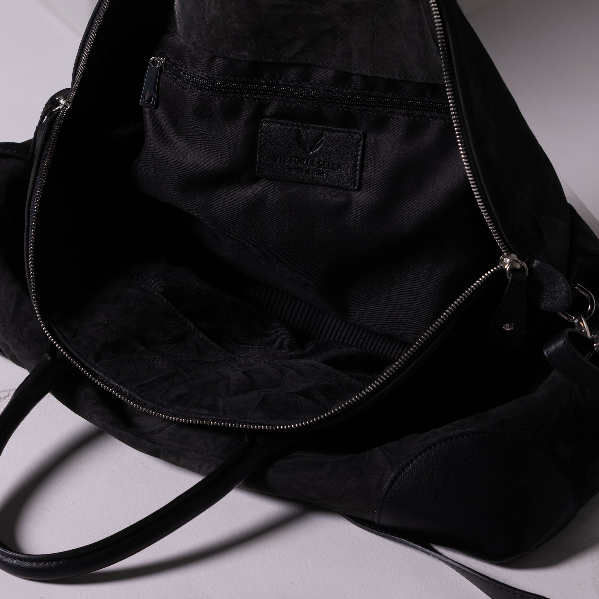 Vesta Maxi Tote Ebony inside view in black nubuck-effect leather with contrasting textures