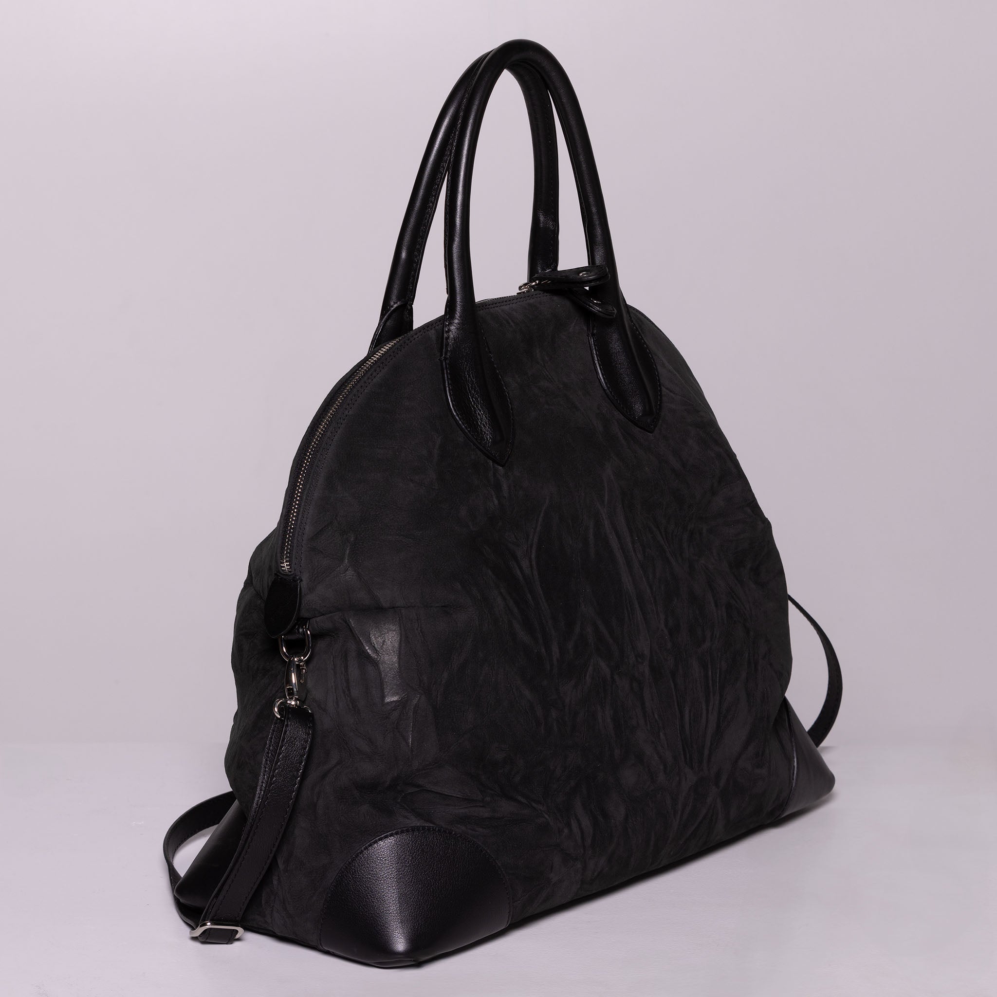 Vesta Maxi Tote Ebony side view in black nubuck-effect leather with contrasting textures