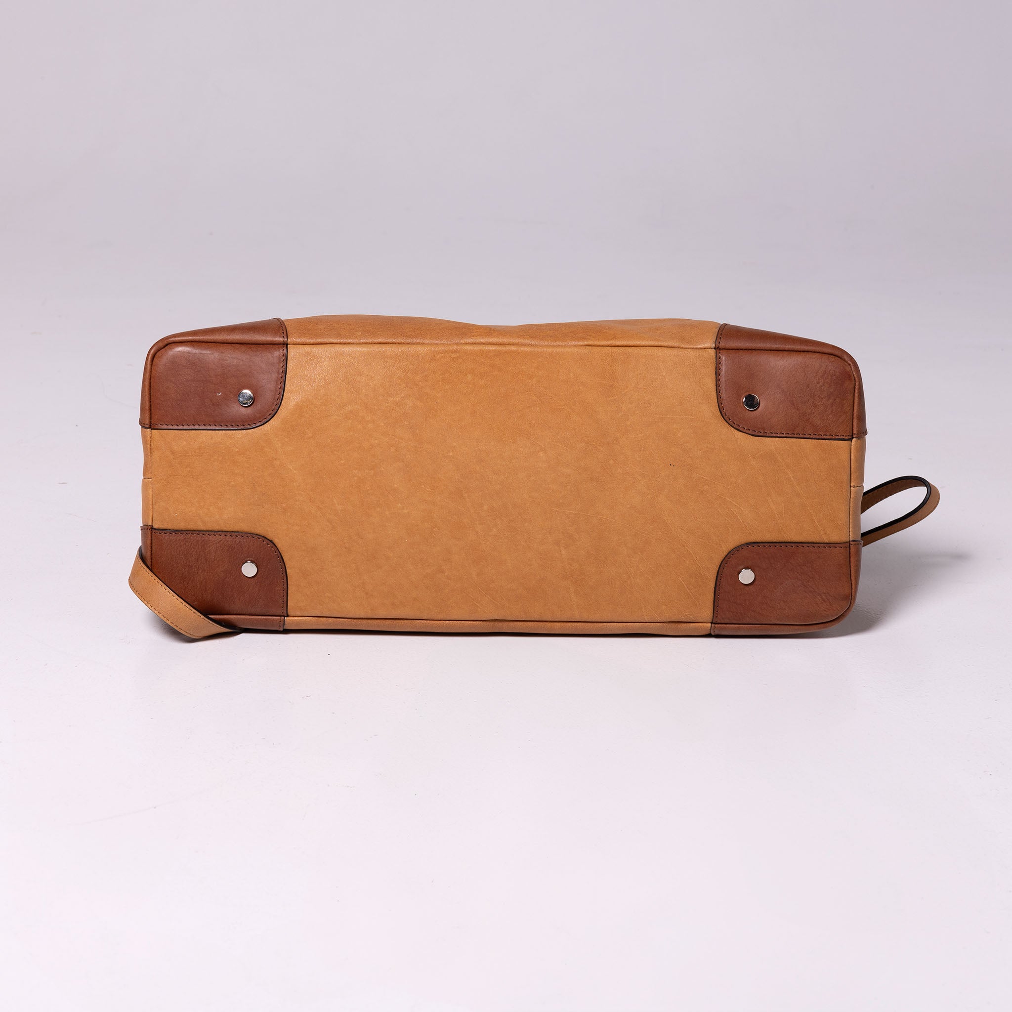 Vesta Maxi Tote Caramel & Bourbon bottom view with protective studs
