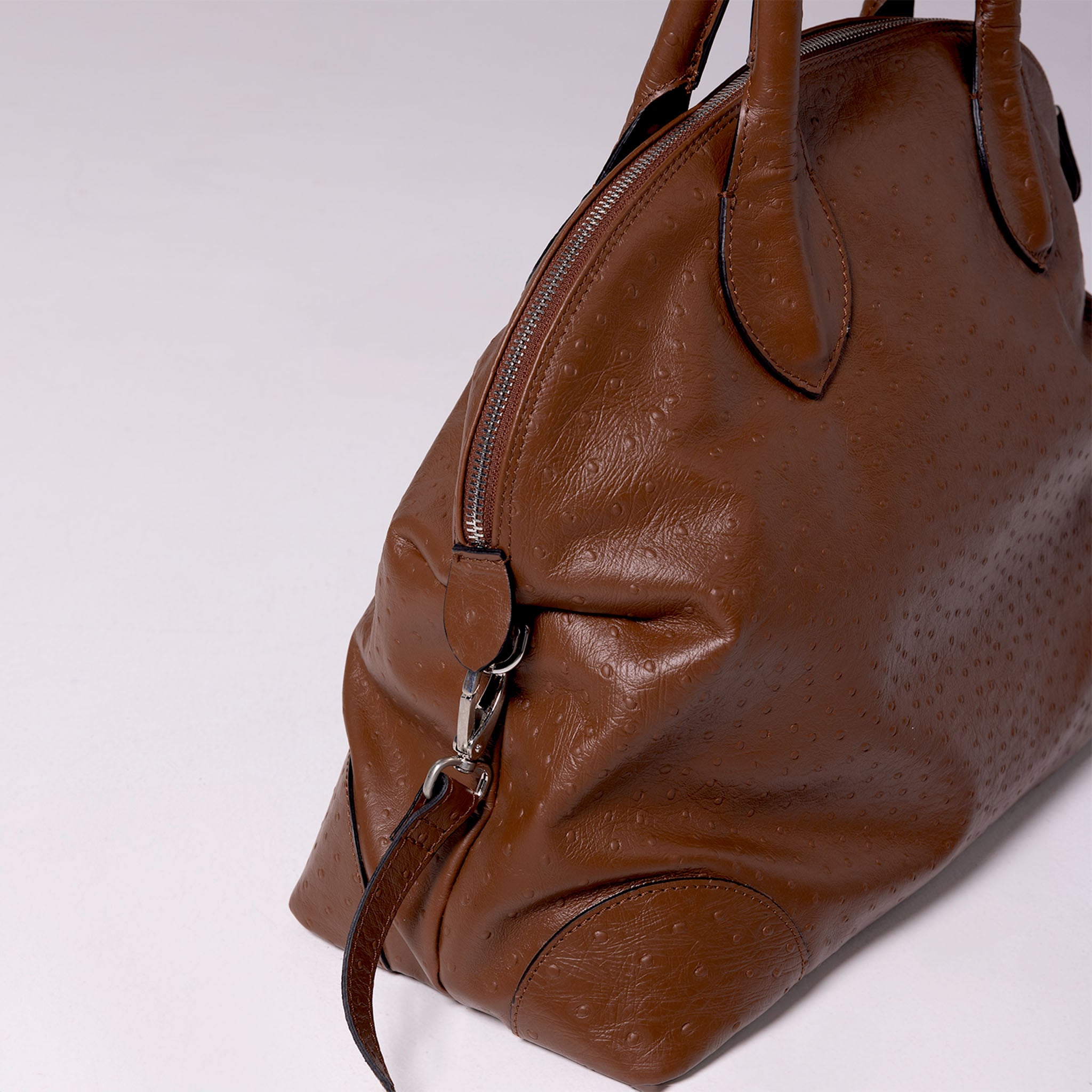 Vesta Tote Brown side view in ostrich-effect brown calfskin